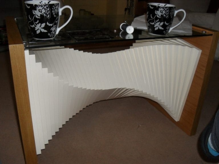 Sculpted console table with stacked white layers and a timber frame