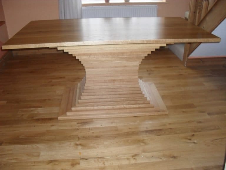 Close up of a stepped timber table pedestal