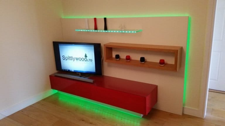 Red media unit with floating shelves and green LED lighting