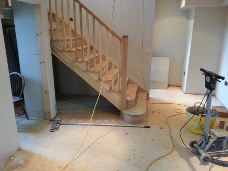 Timber staircase fitted in a room under construction