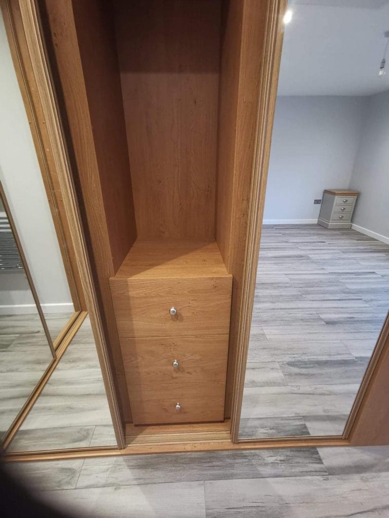Timber wardrobe unit with drawers and shelves