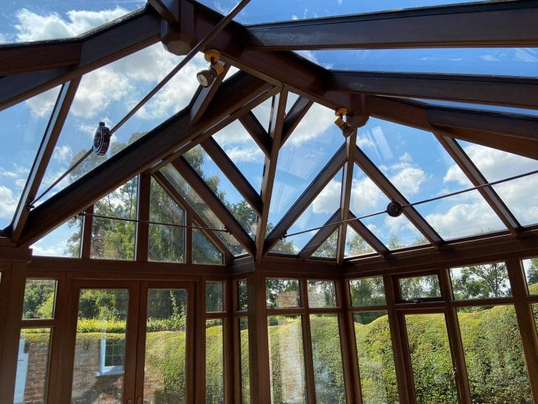 Timber conservatory roof rafters and glazing from below