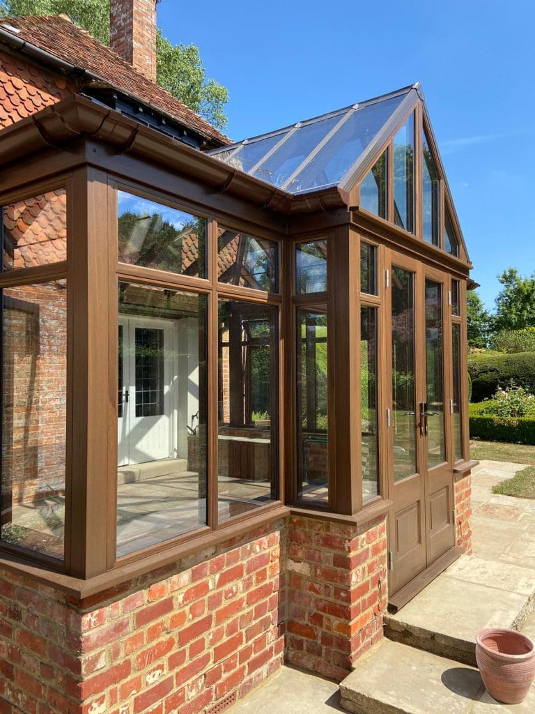 Stained timber conservatory doors and side frames