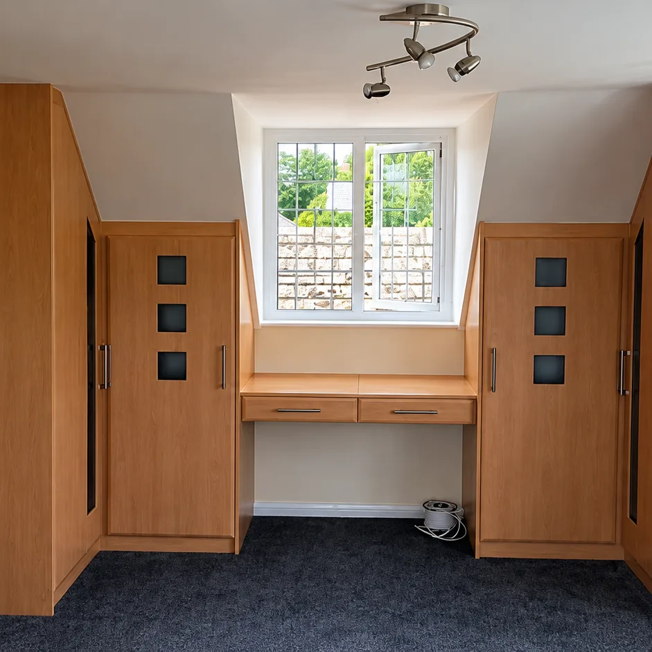 Fitted bedroom wardrobes with a built-in desk in a Kent home, made by Spittlywood
