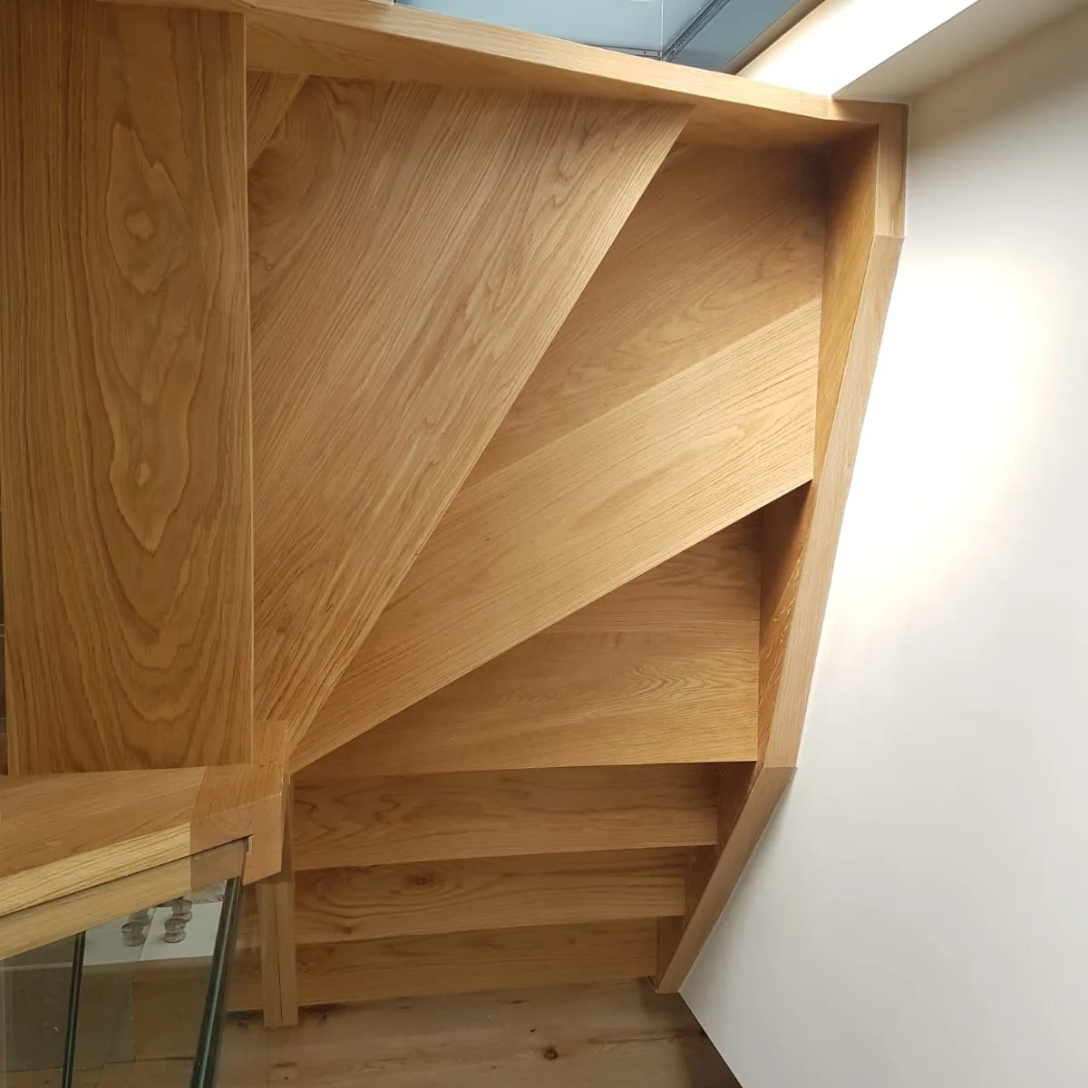 Underside of an oak winder staircase showing the joinery, made by Spittlywood