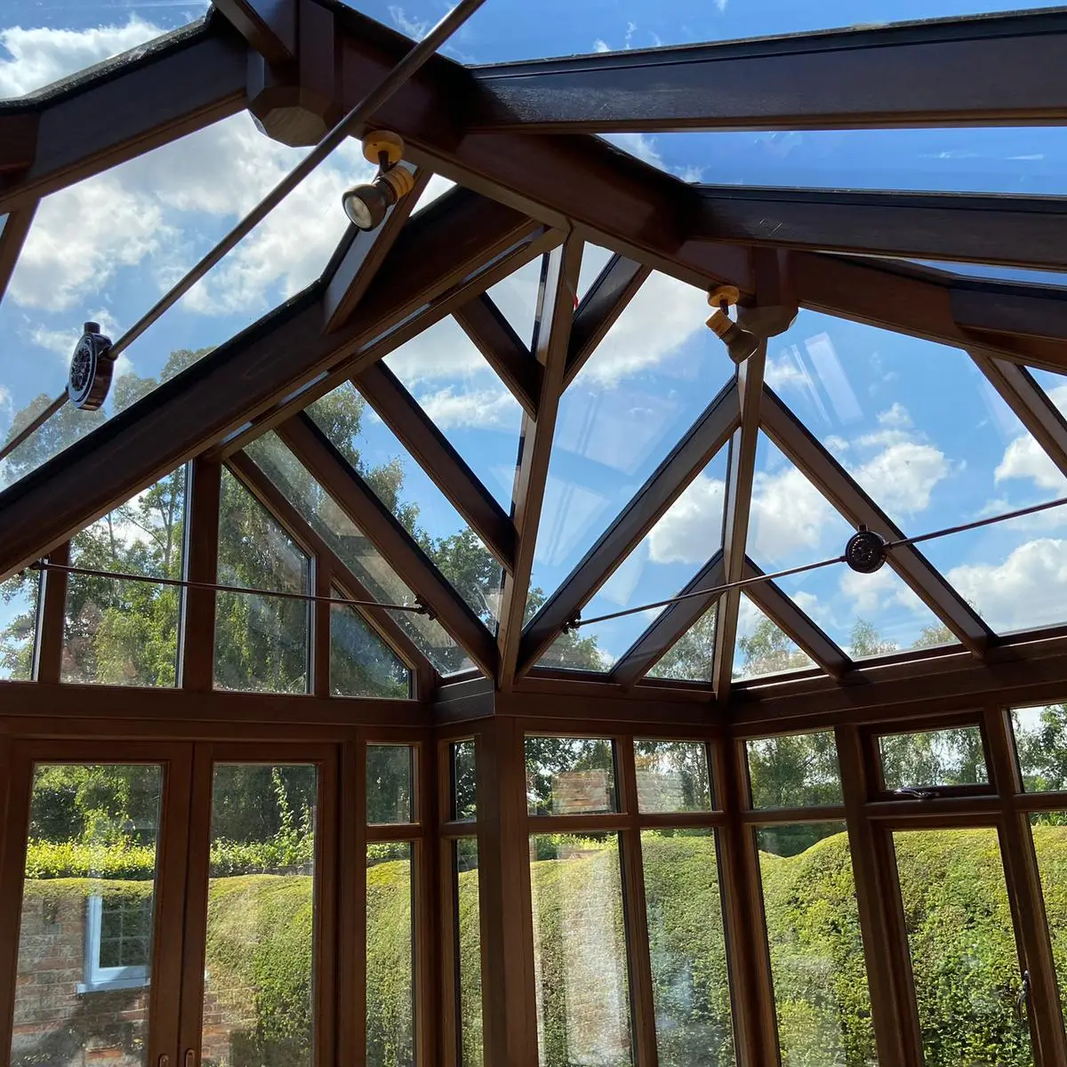 Oak roof trusses inside a timber orangery, made by Spittlywood