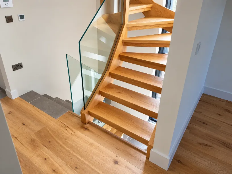 Open tread oak staircase in a Kent home, made by Spittlywood