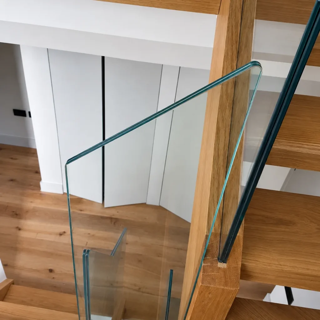 Oak and glass balustrade detail on a bespoke staircase in Kent